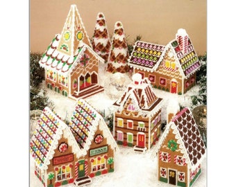 Mönster av plastduk med pepparkaksby, kyrka, träd, hus, butiker