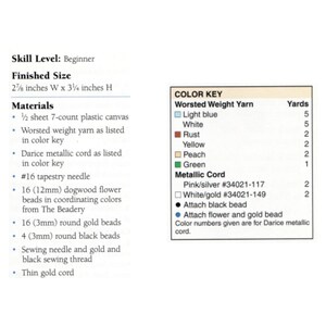 May include: A color key chart for a craft project. The chart lists the colors and quantities of worsted weight yarn and metallic cord needed for the project. The yarn colors include light blue, white, rust, yellow, peach, and green. The metallic cord colors include pink/silver and white/gold. The chart also includes instructions for attaching black beads and flower and gold beads.