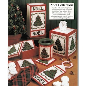 May include: A Christmas-themed craft set featuring a tissue box cover, a mug, a door hanger, a bookend, and six coasters. The set is decorated with red, green, and white colors and features a Christmas tree design with the word "NOEL" on it.