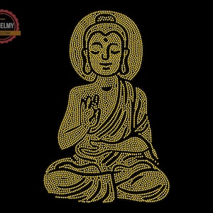 May include: A gold rhinestone design of a meditating Buddha. The Buddha is sitting in a lotus position with hands in a mudra gesture.