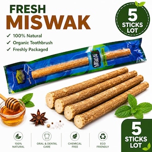 May include: A lot of five Miswak sticks, with one stick inside a blue and green plastic wrapper labeled FRESH MISWAK. The sticks are light brown, woody, and cylindrical. Also included are a small glass bowl of honey, a star anise, and mint leaves.