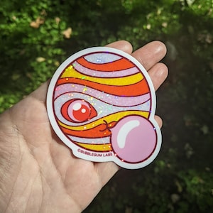 How Jupiter Makes Her Moons (Vinyl Sticker) - Holographic Glitter Sticker - Cute Spacey Laptop Sticker - Waterproof Water Bottle Sticker