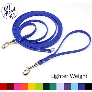 May include: Blue rubber dog leash with two clips and silver hardware. The leash is coiled and has a shorter handle. The text "Lighter Weight" is printed below the leash.
