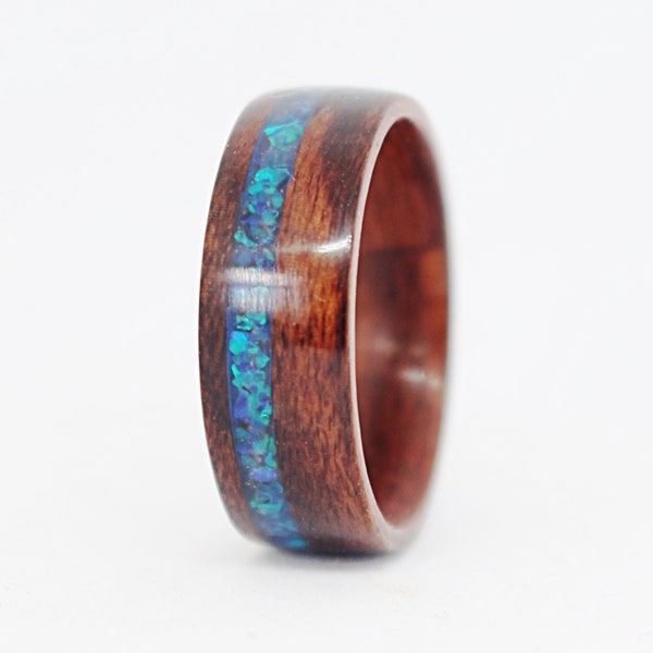 Santos Rosewood ring with an offset ocean blue opal inlay. Handcrafted natural wood ring. Women's ring or mens ring. Exotic hardwood band