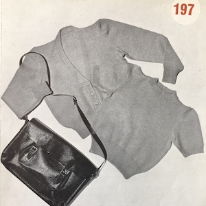 May include: Two gray knitted sweaters and a black leather satchel bag. The sweaters have a v-neck and a round neck. The bag has a strap and a buckle.