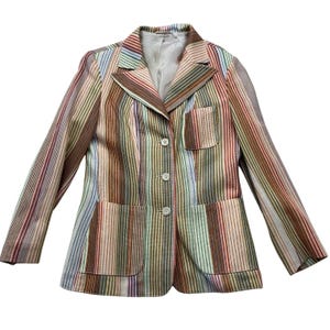 May include: A set of three ceramic mugs with a speckled, matte finish in cream, light grey, and dark grey. Each mug has a simple, minimalist design, ideal for coffee or tea.