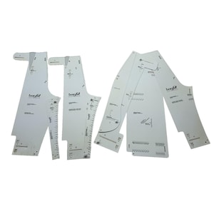 May include: Four white Bonfit pattern pieces for sewing, featuring markings, measurements, and the Bonfit logo. The pieces are arranged on a white background. The patterns appear to be for a garment.