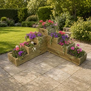 May include: A tiered corner wooden planter box featuring a stepped design with multiple levels. The natural wood structure is filled with various colourful flowers, including pink, purple, and white blossoms, arranged in separate rectangular sections.