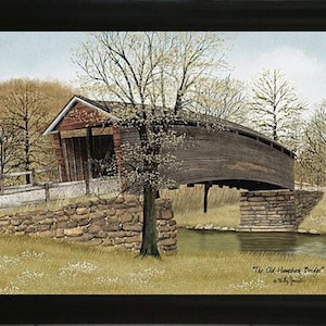 May include: A painting of a covered bridge with a wooden structure and a red roof. The bridge is over a stream with green grass and trees on either side. The painting is titled "The Old Hampshire Bridge" by "Billy Jacobs".