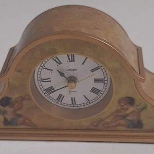 Vintage Lindor mini clock with cherubs 5.5&quot; x 2.89&quot;.