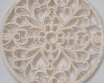 Vintage white cast iron scrolled trivet/wall hanging 8".