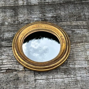 "Louise" patinated gold mirror with witch's eye diam. 24 cm