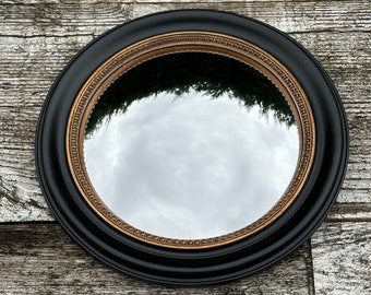 Miroir Adélaïde noir et patine dorée cuivré avec oeil de sorcière diam 24 cm