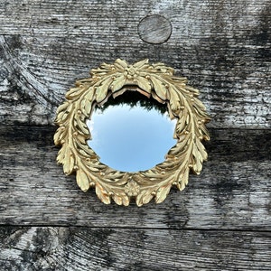 Golden Courtney mirror with witch's eye Diam 15 cm