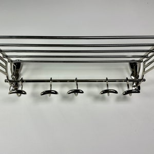 “Orient Express” coat rack in shiny chrome-plated aluminum