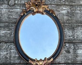 Miroir ovale feuillage de style Louis XV noir et doré 38 x 25 cm