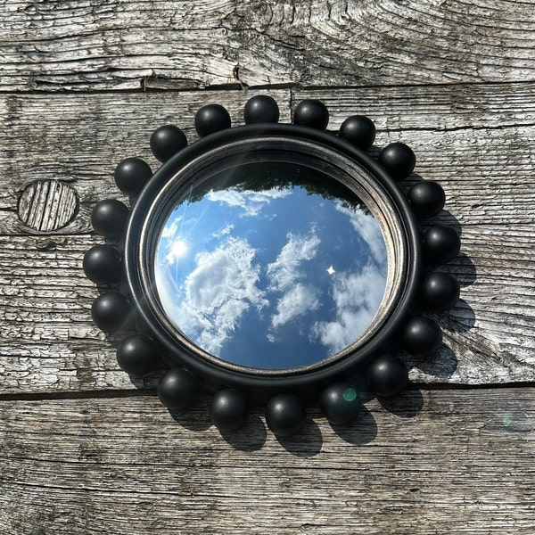 Miroir rond Pompon noir et léger doré avec oeil de sorcière diam 21,5 cm