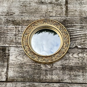 Mirror "Josephine" gilded with witch's eye diam 13 cm