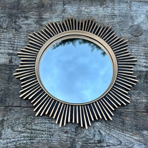 "Irene" black and gold patinated mirror with witch's eye diam. 30 cm