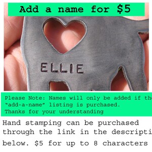 May include: A metal cutout of a dog with a heart-shaped hole in the center. The dog's name "ELLIE" is stamped on the metal. The image includes the text "Add a name for $5".