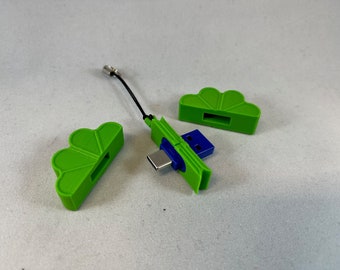 May include: A green USB adapter with a blue USB connector and a green cap. The adapter has a small loop for attaching a keychain.