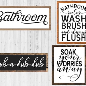 May include: Four wooden signs with black and white lettering. The signs read "Bathroom", "Bathroom rules WASH BRUSH and always FLUSH", "scrub-a-dub-dub", and "SOAK your WORRIES away".