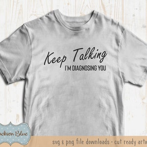 May include: A grey t-shirt with the text "Keep Talking I'M DIAGNOSING YOU" printed in black.