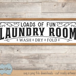 May include: A wooden sign with the text "Loads of Fun Laundry Room" and the words "Wash Dry Fold" in a decorative font.