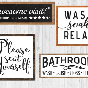 May include: Four wooden signs with black text on a white background. The signs read "Awesome visit!" with five stars, "Please seat yourself", "Wash soak relax", and "Bathroom Wash Brush Floss Flush".