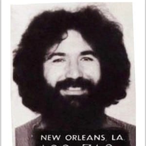 May include: Black and white mugshot of a man with long, curly hair and a beard. The mugshot has the text "NEW ORLEANS, LA" and the numbers "123 712" and "1 31 70".