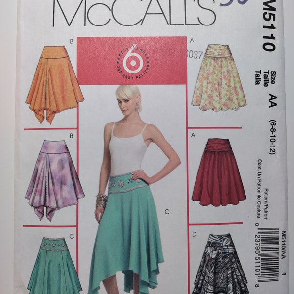 McCall's M5110 flared skirt below mid knee has yoke, side zip and shaped hemline variations, sizes 6,8,10,12, uncut and FF See description