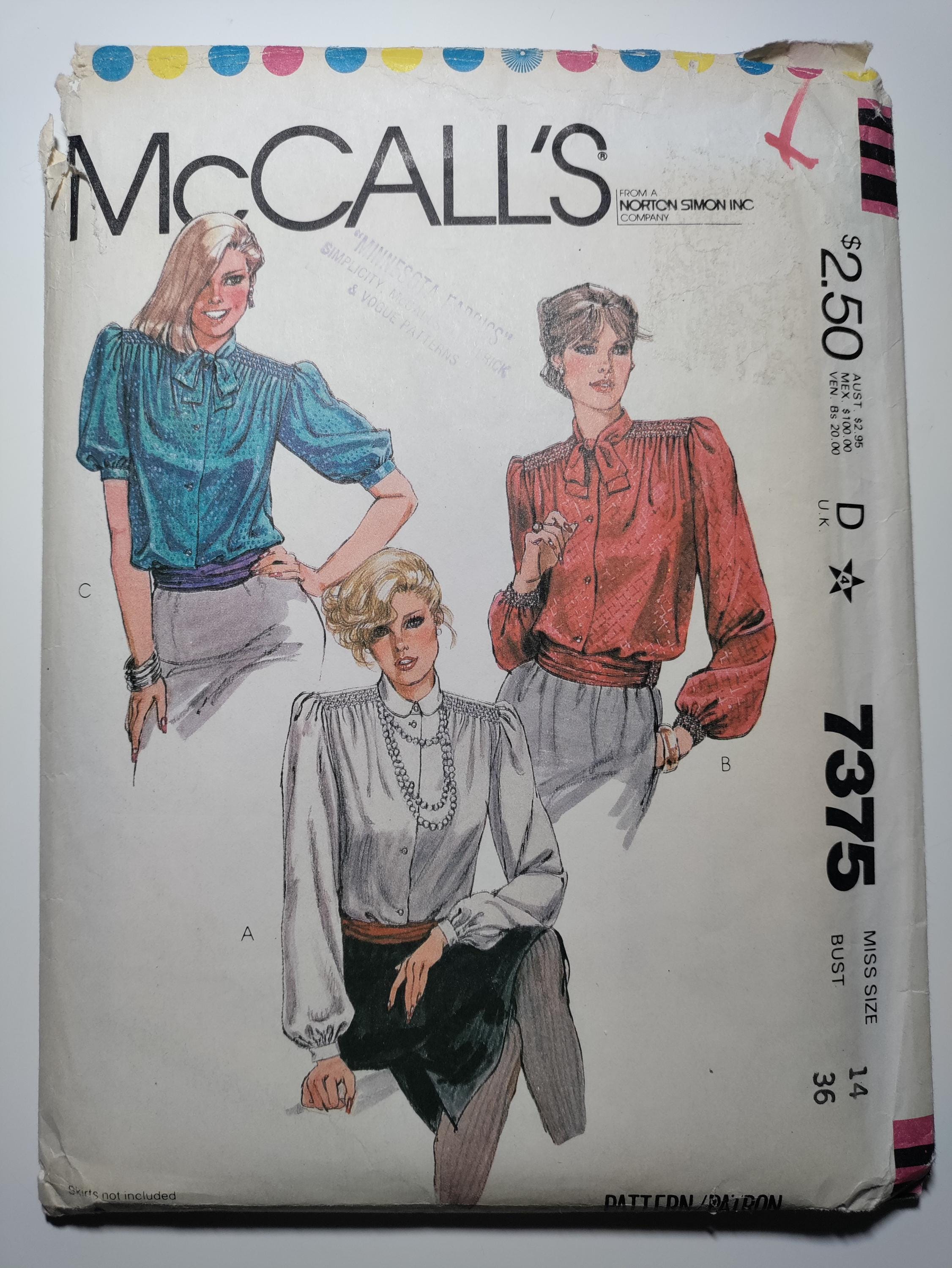 McCall's 7375 blouse with smocked shoulders and cummerbund, includes blue transfers size14 uncut and factory folded, see description C1980 C