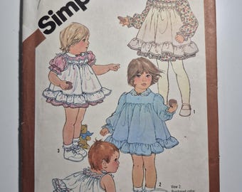 Simplicity 5777 toddlers dress, pinafore and panties, toddler size 1, uncut and factory folded, see description and photos C.1982