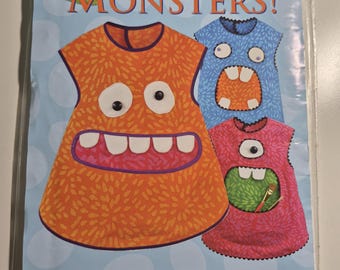 Smock Monsters! Sizes 18 mo, 2T, 3T, 4T,5,6,7, uncut and factory folded, see description and photos C.2011
