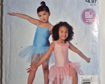 McCall's 9315 girls leotard, sizes Xxs,Xs,S,M,L, uncut and factory folded, see description and photos C.2018