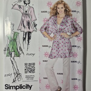 May include: Simplicity sewing pattern 1896A featuring a woman wearing a floral print top and white pants. The pattern includes illustrations of different styles, with the words "Flirty" and "Edgy". The text "SUEDE says" is visible.
