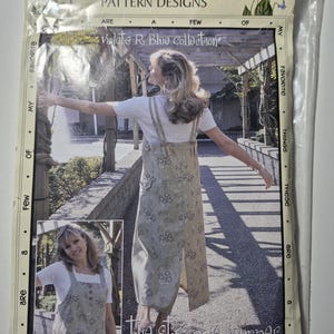 May include: A package for a sewing pattern titled "Favorite Things Pattern Designs." The pattern features a woman wearing a floral print jumper. The text on the package reads "Violets R. Blue Collection" and "the strappie jumper."
