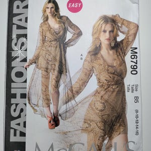 May include: A sewing pattern for a dress with a wrap style bodice and long sleeves. The pattern is for sizes B5 (8-10-12-14-16) and is labeled "Easy" and "Fashion Star". The pattern is from McCall's.
