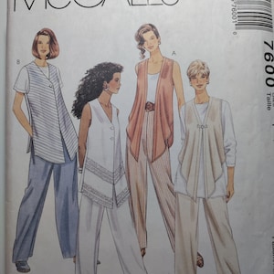 May include: A sewing pattern for a women's top and pants. The pattern includes three different styles: a striped top with a vest, a white top with a vest, and a white top with a vest and a tie. The pattern is called "Select-A-Size" and is for sizes 6-14.