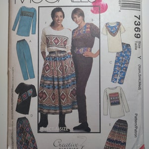 McCall's 7369 tops, pull on pants and skirt, belt, size Xsm,SML,Med, uncut and factory folded, see description and photos