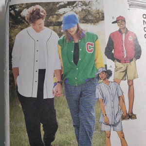 May include: A sewing pattern featuring three people wearing casual clothing. The pattern includes a white baseball jersey, a green and yellow varsity jacket, and a striped baseball shirt. The pattern is titled "McCall's" and includes the text "Learn to Sew for Fun".