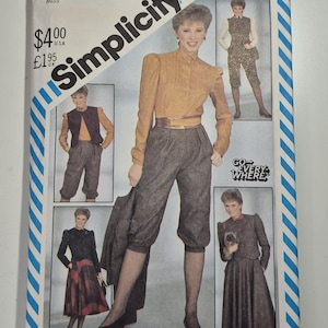 May include: Simplicity sewing pattern featuring a woman in various outfits. The cover includes images of a mustard-colored blouse, gray pants, and a jacket. The pattern is size 10.