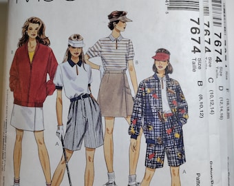 May include: McCall's sewing pattern number 7674 for women's clothing. The pattern includes three different outfits: a striped shirt with a skirt, a white shirt with shorts, and a plaid jacket with shorts. The pattern is available in sizes 8-12, 10-14, and 12-16.