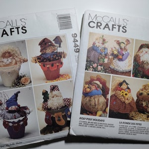 May include: Two McCall's Crafts sewing patterns for holiday-themed decorations. The pattern on the left is for a snowman, a scarecrow, a Santa Claus, and an angel, all in pots. The pattern on the right is for a Santa, a turkey, a rabbit, and a scarecrow, all in pots. The pattern numbers are 9449 and 7403.