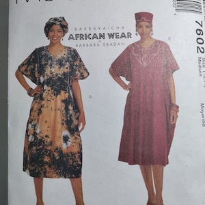 May include: A sewing pattern for a dress with two different styles. The dress on the left is a printed fabric with a tie-dye pattern. The dress on the right is a solid burgundy color. Both dresses have a v-neck and short sleeves. The pattern is called "African Wear" by Barbara Ebadan.