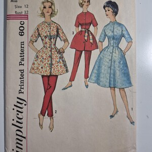 May include: A Simplicity 4221 sewing pattern envelope for Miss size 12, bust 32. The illustration shows three outfits: a floral tunic with red pants, a solid red tunic with pants and a striped belt, and a light blue patterned dress with buttons.