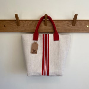 Bolsa de mano Hop Sack con rayas rojas y azules