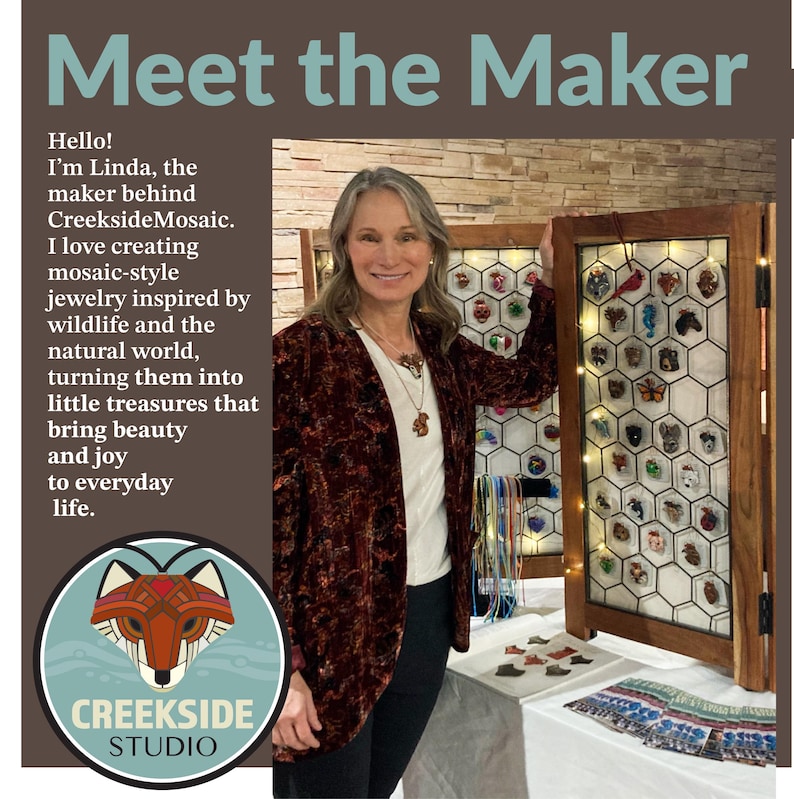 Photo shows artist Linda Webb with a collection of her mosaic pendant designs.