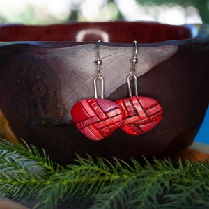 Photo shows bright red dangle mosaic earrings in an inverted triangle shape. The wires are shiny Sterling silver.