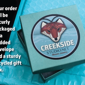 Your package will arrive securely-packaged in a sturdy, recycled, teal box and matching padded envelope.